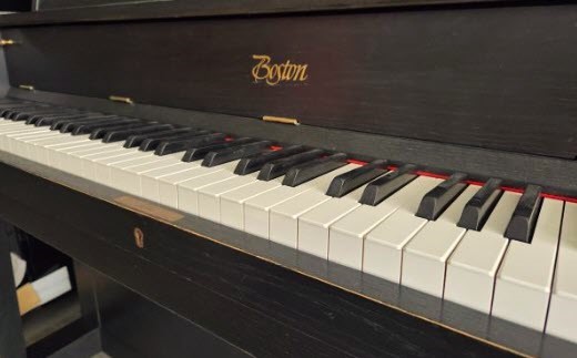 Close-up of Boston by Steinway piano keys.