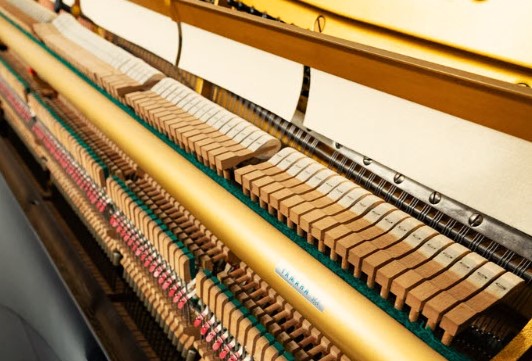 Yamaha U3 Piano new action mechanism with hammers and strings.
