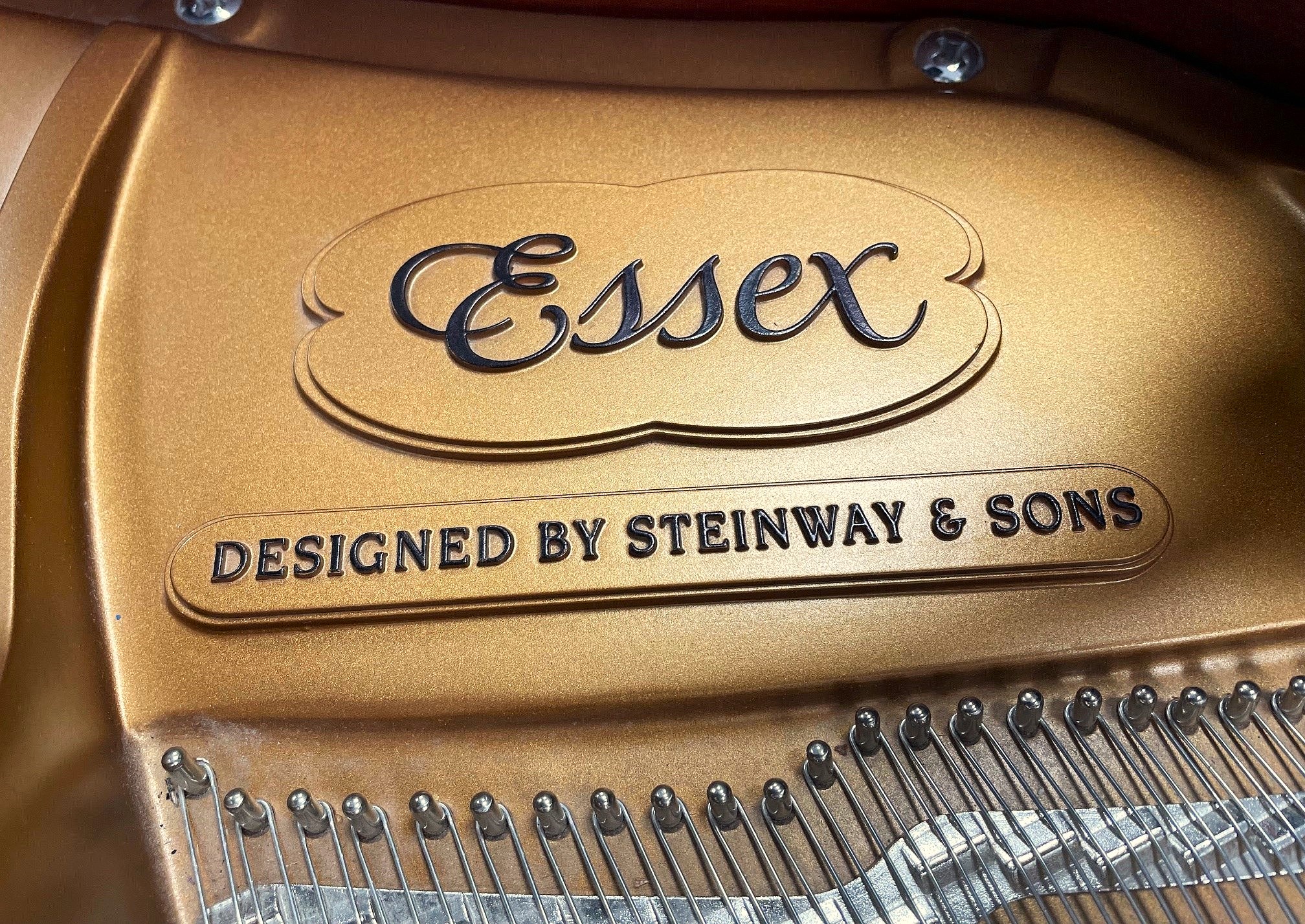Essex piano, designed by Steinway & Sons logo.
