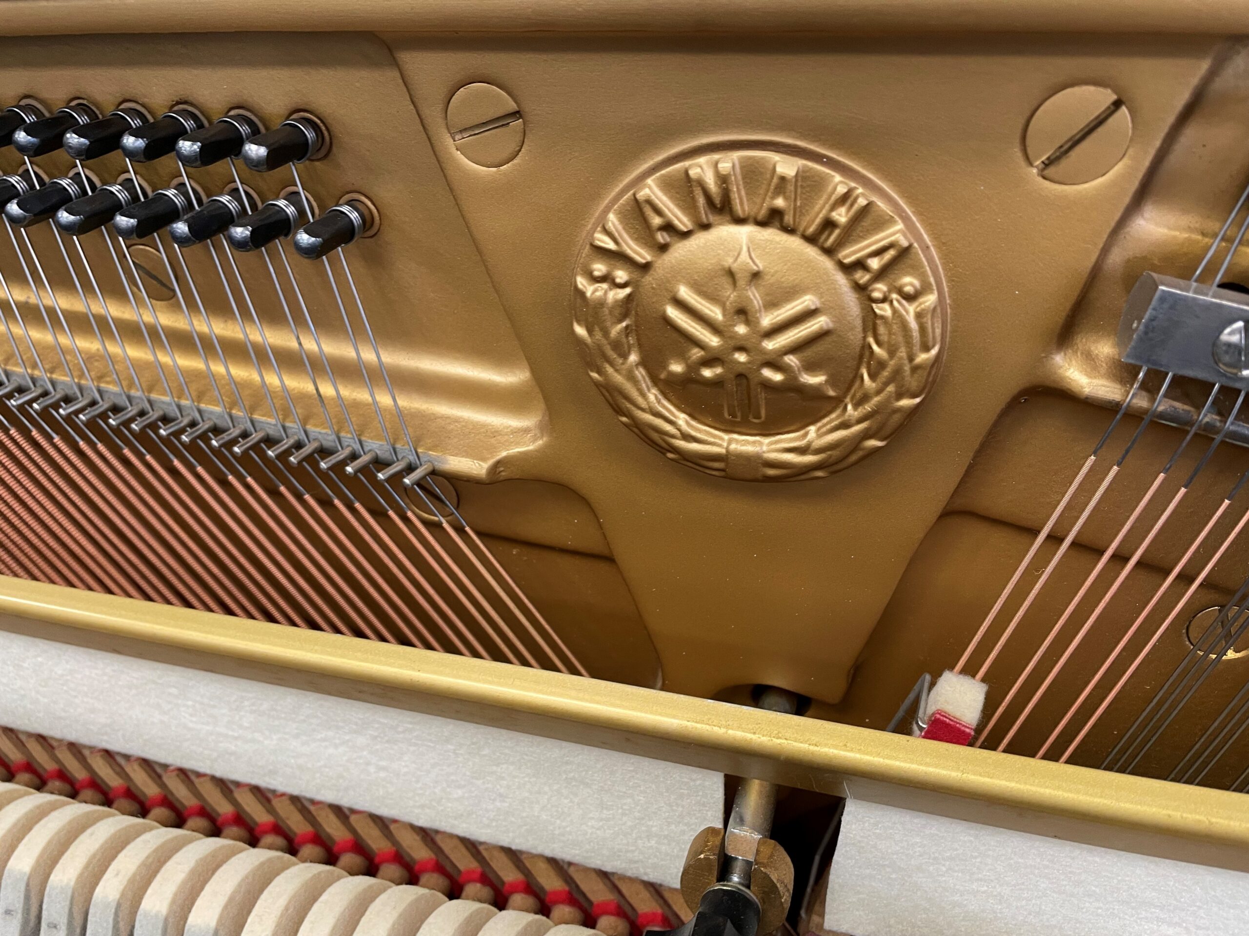 Close-up of Yamaha U3 piano new strings