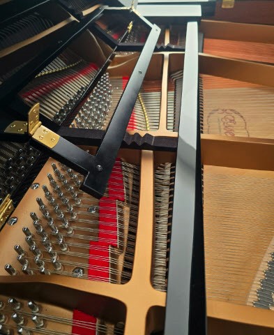 Close-up of an Essex grand piano's interior strings.