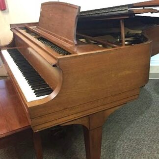 Steinway grand piano in walnut finish