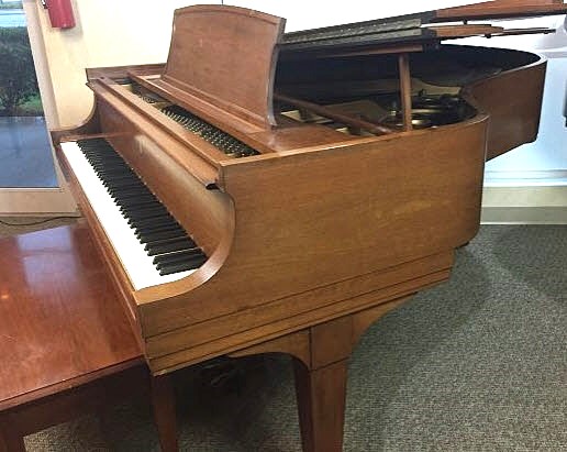 Steinway grand piano in walnut finish